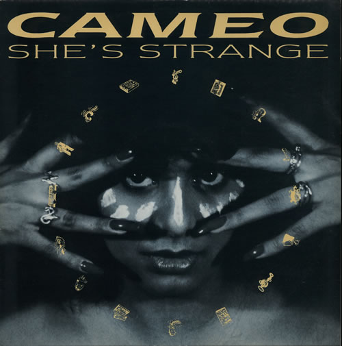 Cameo — She&#039;s Strange cover artwork