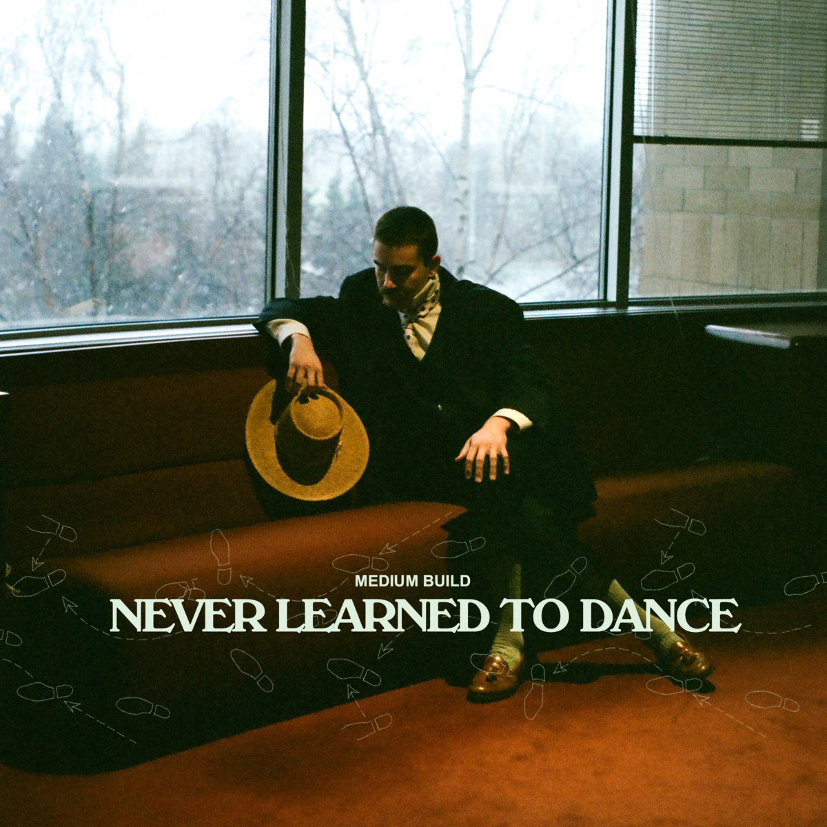 Medium Build — Never Learned To Dance cover artwork
